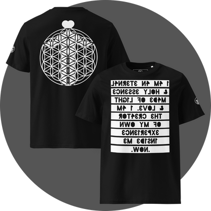UN4RT black organic cotton t-shirt shown from the front and back, front features a large mirrored text artwork on a white rectangular background with the reversed phrase "i am an eternal & holy essence, made of light & love. i am the creator of my own experience inside me. now." in bold black lettering, back features a large white flower of life sacred geometry circle with a white heart above it, circular brand logo visible on the left sleeve.