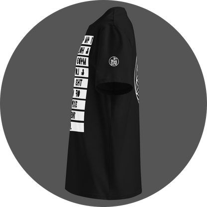 UN4RT black organic cotton t-shirt shown from the left side, featuring the mirrored text artwork printed on a white rectangular background running down the front, with partial lines of reversed bold black lettering visible, small circular brand logo printed on the left sleeve area.