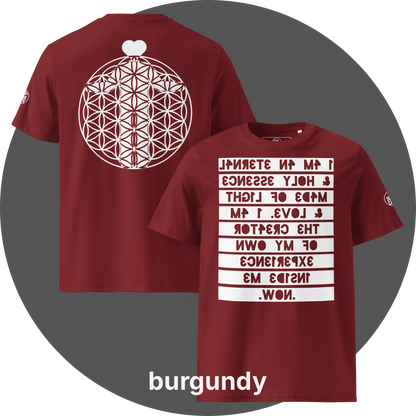 UN4RT burgundy organic cotton t-shirt shown from the front and back, front features a large mirrored text artwork on a light rectangular background with reversed bold lettering reading "i am an eternal & holy essence, made of light & love. i am the creator of my own experience inside me. now.", back features a large flower of life sacred geometry circle with a white heart shape above it, small circular brand logo visible on the left sleeve.