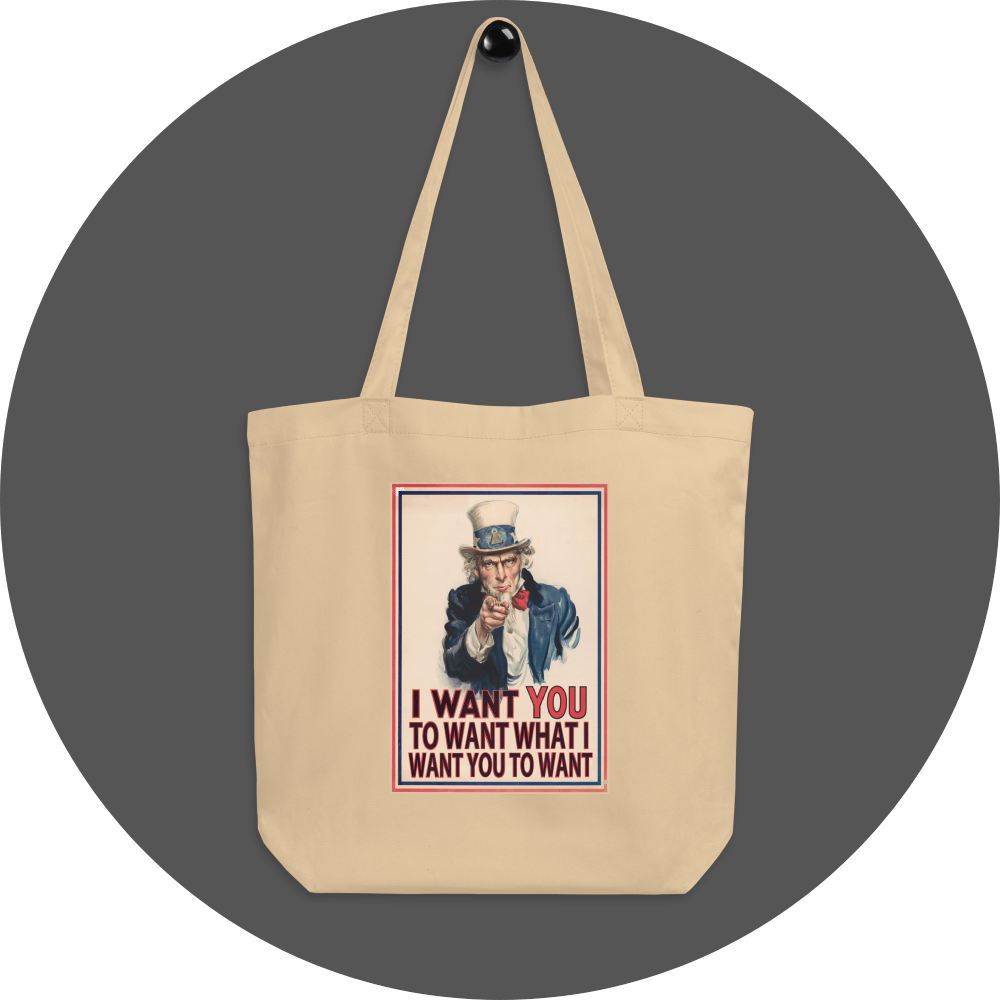 un4rt - the image shows an oyster cotton tote bag with an edited picture of the famous "uncle sam" painting where he is pointing at the viewer with his index finger. the picture is framed with red and blue lines. the text below the picture reads: "i want you to want what i want you to want".