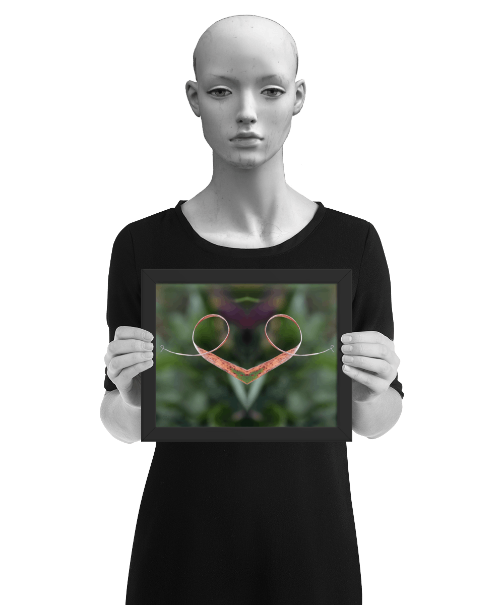 un4rt - the photographie is doubled and then mirrored to create the final image. the image shows a dried blade of grass that has curled up twice. the background is blurry and colored in various tones of green and a bit of purple. the image is framed and presented by a mannequin in black and white.