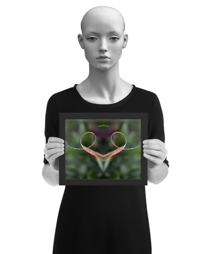 un4rt - the photographie is doubled and then mirrored to create the final image. the image shows a dried blade of grass that has curled up twice. the background is blurry and colored in various tones of green and a bit of purple. the image is framed and presented by a mannequin in black and white.