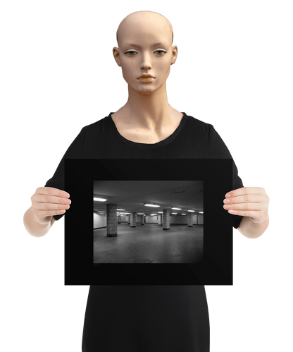 un4rt - a black and white photographie of a former underground trespas that once was part of the train station "alexanderplatz" in berlin. tiled square columns support the ceiling. graffities on the columns and the ceiling. the image is held by a mannequin.