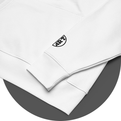 un4rt - the image shows details of white cotton hoodie with a black "UN4RT"-logo embroidery on the left sleeve. only the lower part of the logo is visible.
