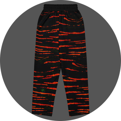 UN4RT tiger lily all-over-print jogging pants back flat – black sweatpants with bold orange-red tiger stripe pattern, two back pockets visible, elasticated waistband and small UN4RT logo at ankle.