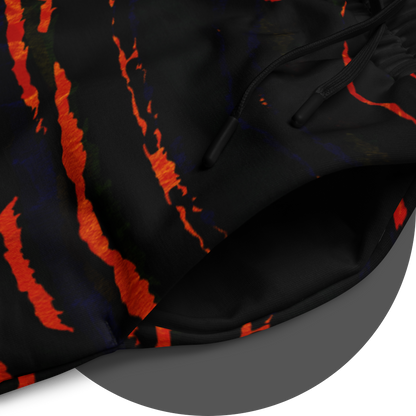 UN4RT tiger lily jogging pants detail – close-up of all-over-print showing fiery orange-red claw scratch pattern on black fabric, elasticated drawstring waistband visible, bold dark art streetwear design.