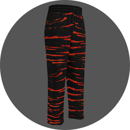 UN4RT tiger lily all-over-print jogging pants front right view – black sweatpants with vivid orange-red tiger stripe print, elasticated drawstring waistband, straight leg cut.