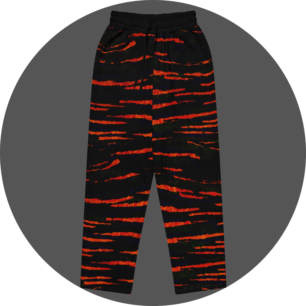 UN4RT tiger lily all-over-print jogging pants front flat – black sweatpants with bold fiery orange-red horizontal tiger stripe pattern across entire surface, elasticated waistband with drawstring.
