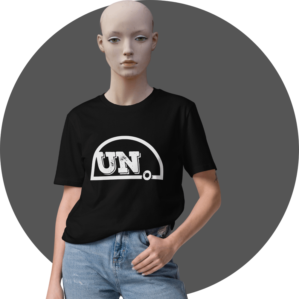 UN4RT black t-shirt, large distressed white "UN." semicircle logo centered on chest, relaxed fit, female mannequin front view, grey circular background.
