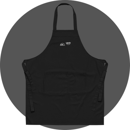 un4rt - the images shows a black apron with white embroidery of a splitted "UN4RT"-logo. 