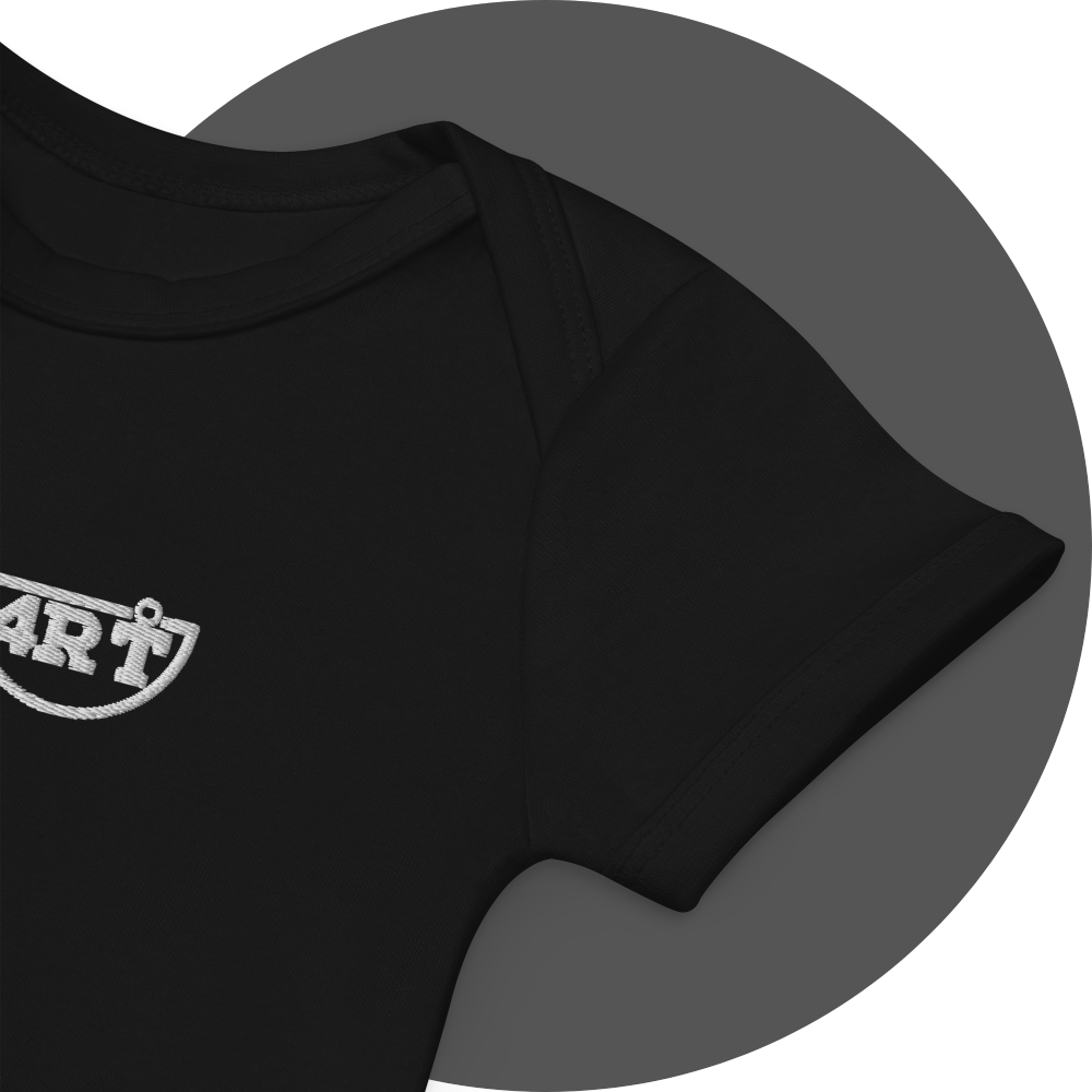 un4rt - the images shows details of a black certified organic cotton baby bodysuit with white embroidery of a part of the splitted "UN4RT"-logo.
