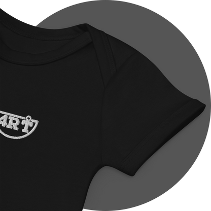 un4rt - the images shows details of a black certified organic cotton baby bodysuit with white embroidery of a part of the splitted "UN4RT"-logo.