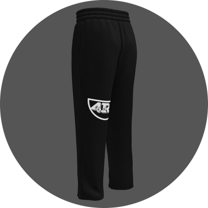 un4rt - the image shows the back of a black jogger pant with a white print of the lower part of the "UN4RT"-logo on the left leg.