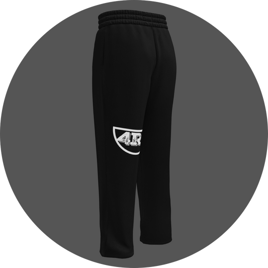 un4rt - the image shows the back of a black jogger pant with a white print of the lower part of the "UN4RT"-logo on the left leg.