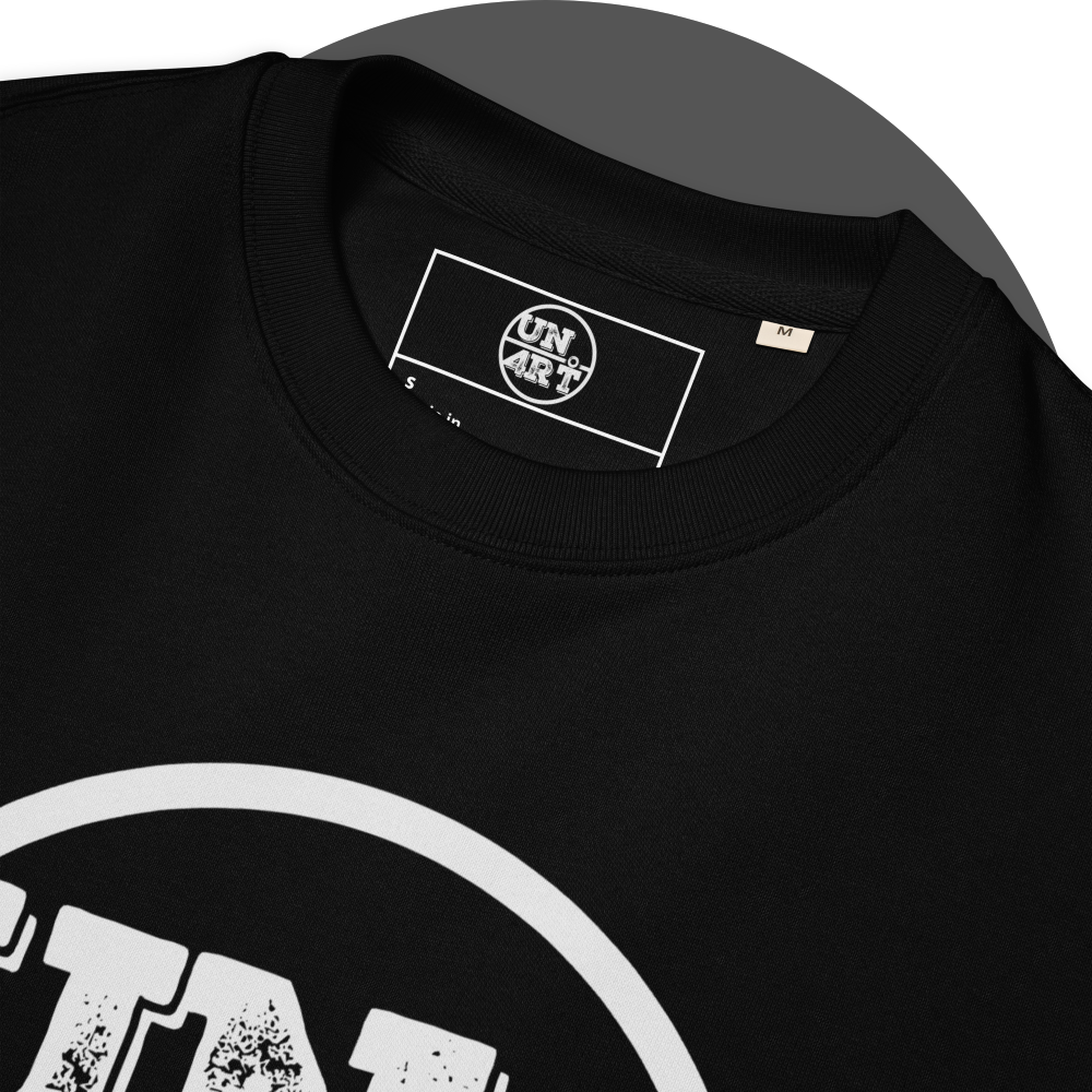 un4rt - the image shows details of the front of a black organic cotton sweatshirt with a part of a big white print of the upper part of the "UN4RT"-logo and an inprinted neck label with the "UN4RT"-logo.