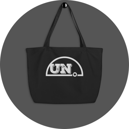un4rt - the image shows a black certified organic cotton tote bag with a big white print of the upper part of the "UN4RT"-logo on it.