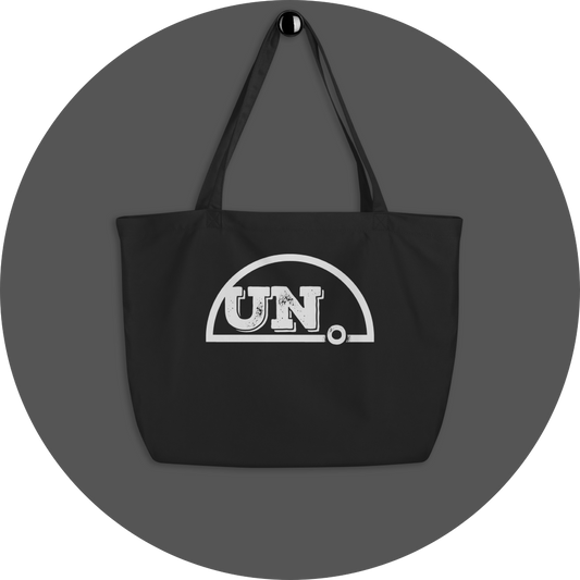 un4rt - the image shows a black certified organic cotton tote bag with a big white print of the upper part of the "UN4RT"-logo on it.